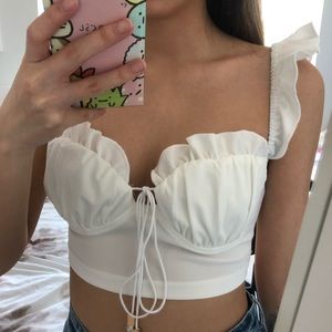 Ruched bust tie front ruffle trim cami top.